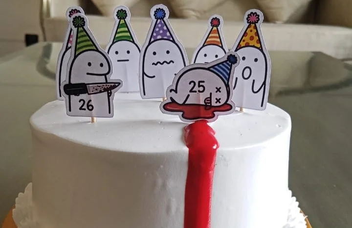 Close view of a personalised birthday cake with custom character cake toppers