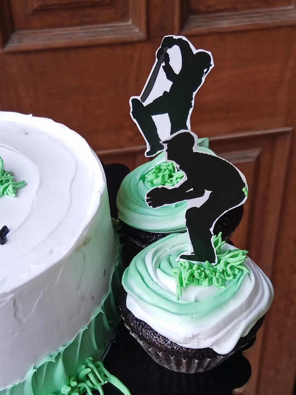 Side view of custom cricket theme birthday cake