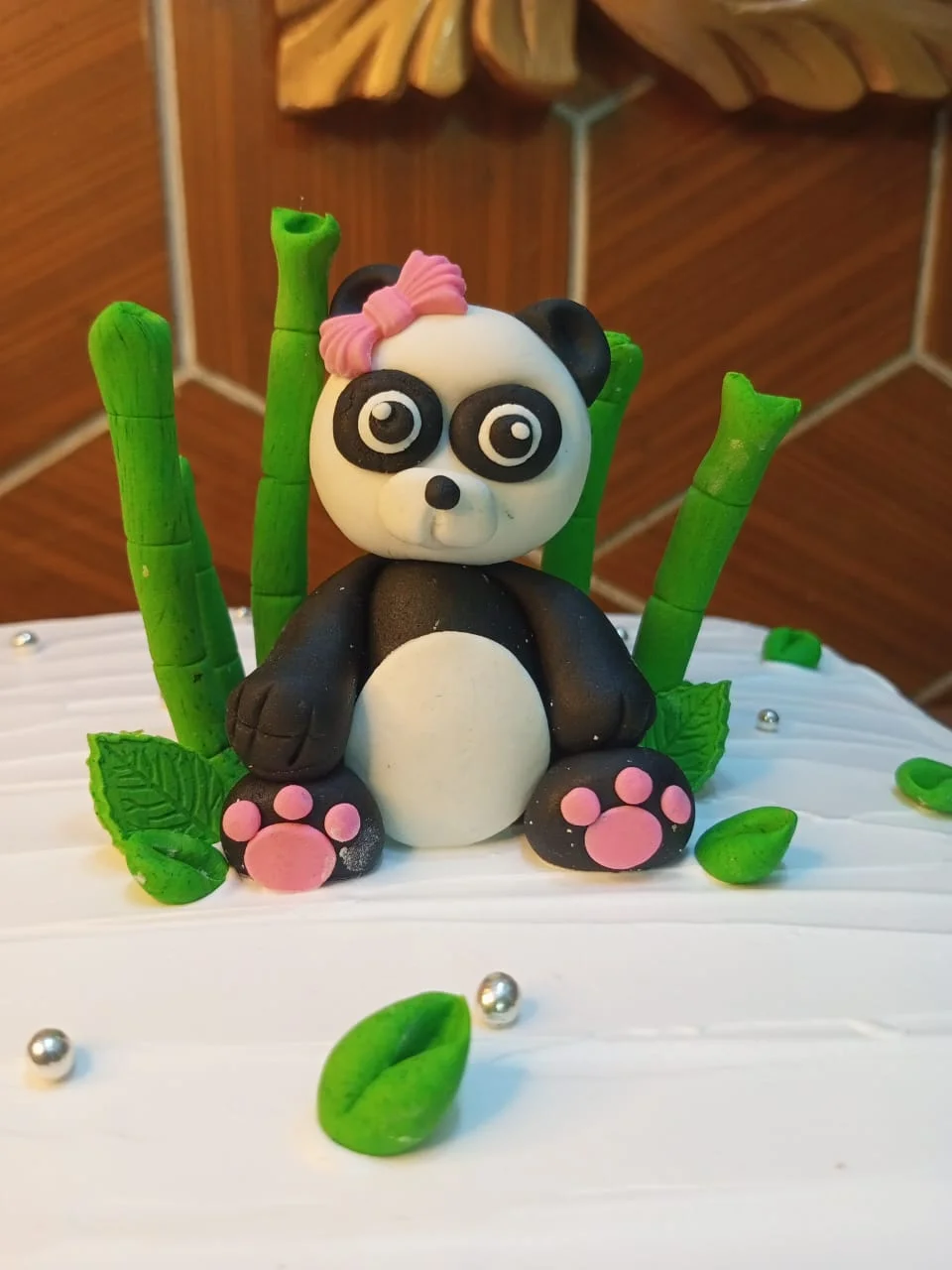 Custom fondant cake with panda decorations