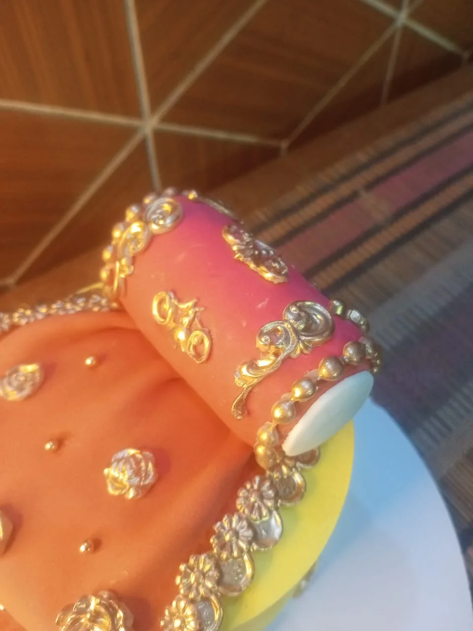 Custom fondant cake with dholki themed decorations