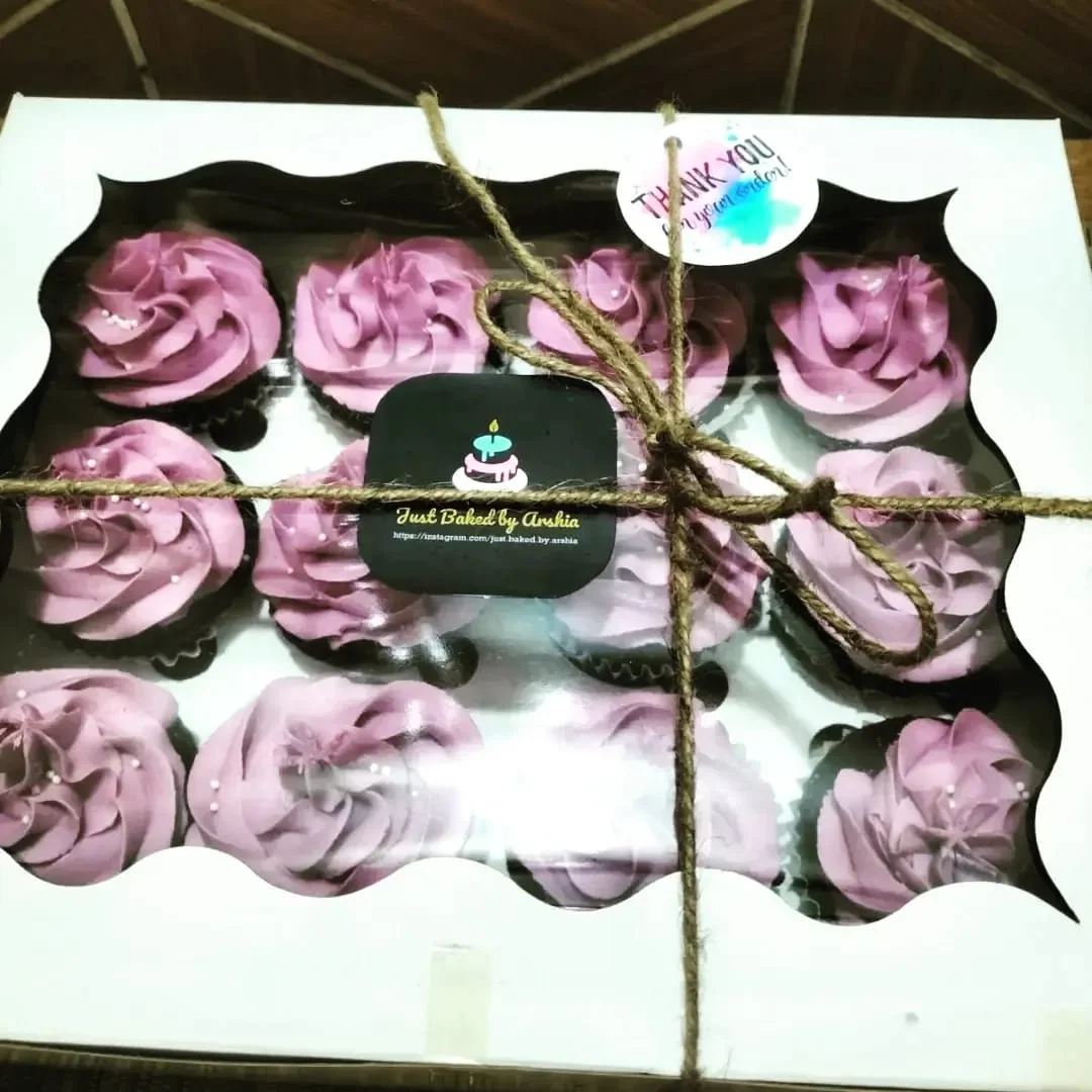 Decorated birthday cake boxed and ready for transport